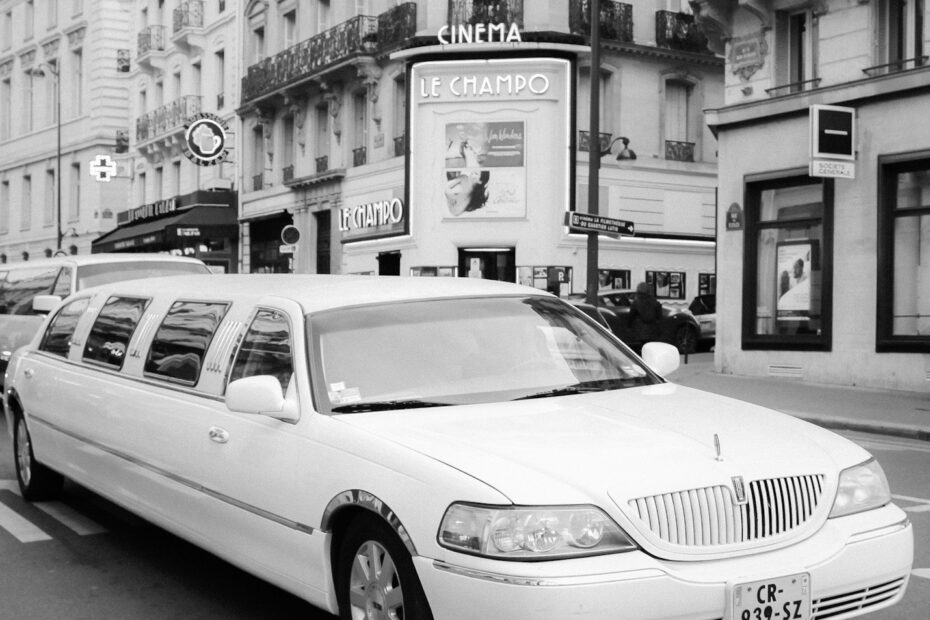 a white limousine parked on the side of the road
